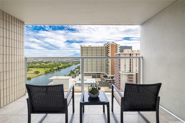 balcony featuring a water view