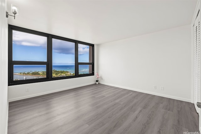 1600 Ala Moana Blvd Unit 2700, Honolulu, HI 96815 - unfurnished room with wood finished floors and baseboards