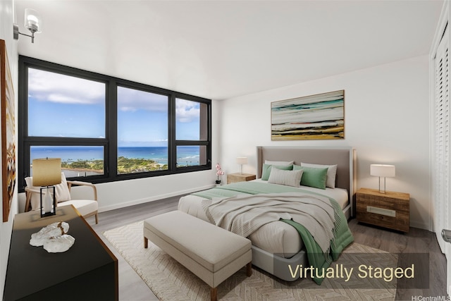 1600 Ala Moana Blvd Unit 2700, Honolulu, HI 96815 - bedroom with wood finished floors and baseboards