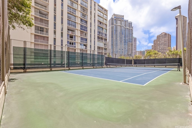 1600 Ala Moana Blvd Unit 2700, Honolulu, HI 96815 - view of tennis court featuring fence and a city view