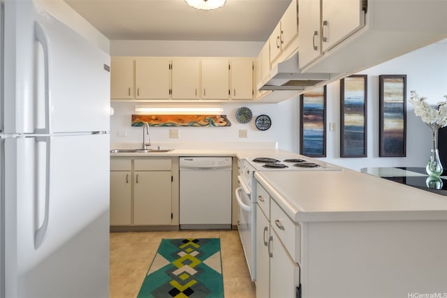 kitchen with a sink, white appliances, light countertops, a peninsula, and under cabinet range hood