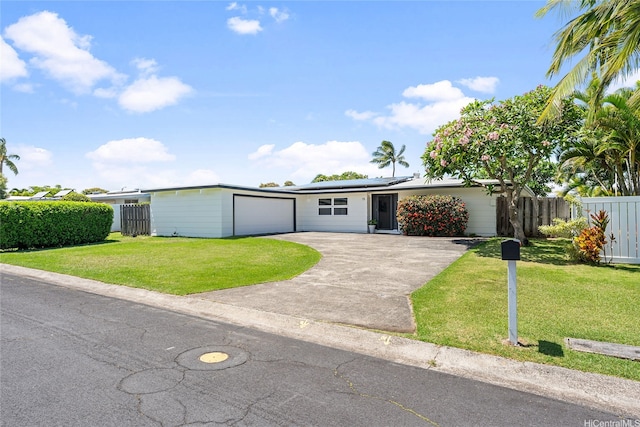 15 Aimikana St, Kailua, HI 96734 - view of front of home with driveway, roof mounted solar panels, and a garage