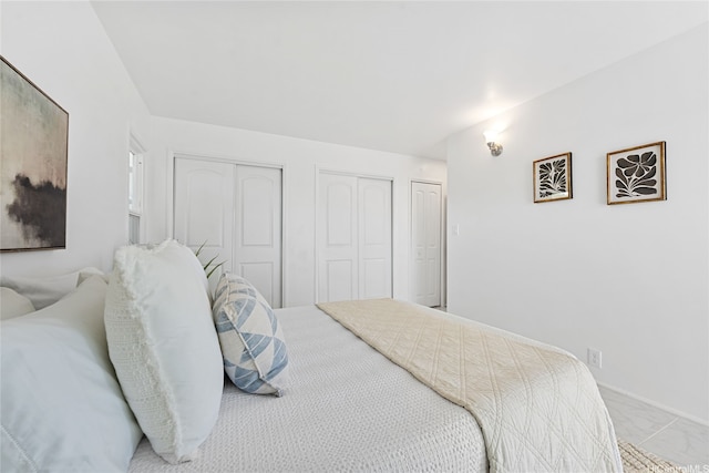 15 Aimikana St, Kailua, HI 96734 - carpeted bedroom featuring two closets