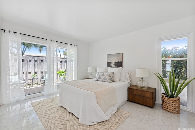 15 Aimikana St, Kailua, HI 96734 - bedroom with access to outside and light marble finish flooring