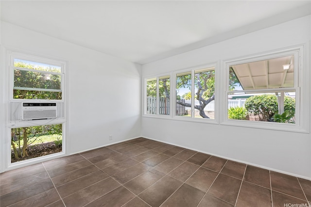 15 Aimikana St, Kailua, HI 96734 - spare room with dark tile patterned floors, baseboards, and cooling unit