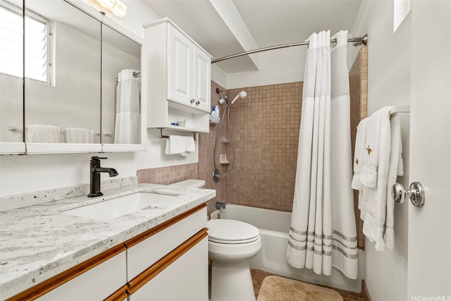 full bath featuring shower / bath combo with shower curtain, toilet, and vanity
