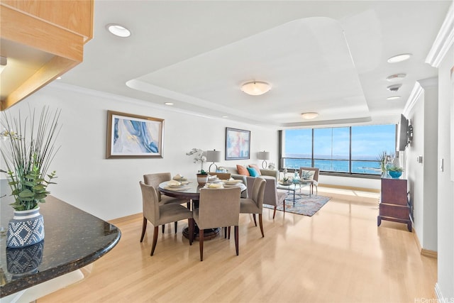 1600 Ala Moana Blvd Unit 2406, Honolulu, HI 96815 - dining room featuring a raised ceiling, light wood-style floors, recessed lighting, and crown molding