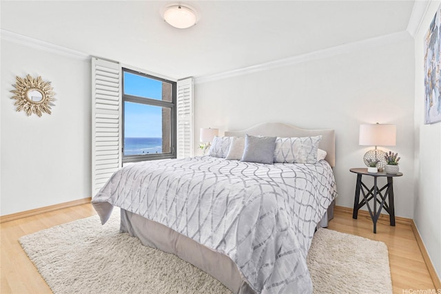 1600 Ala Moana Blvd Unit 2406, Honolulu, HI 96815 - bedroom featuring ornamental molding, wood finished floors, and baseboards