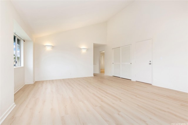 95-1090 Puneki St, Mililani, HI 96789 - unfurnished room featuring light wood-type flooring, baseboards, and high vaulted ceiling