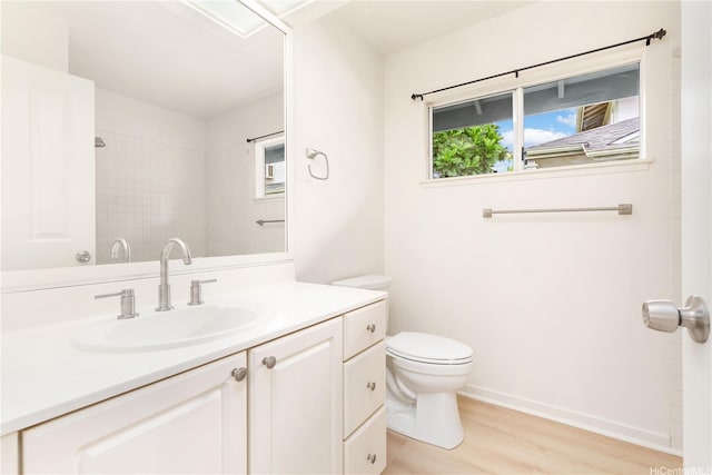 95-1090 Puneki St, Mililani, HI 96789 - full bathroom featuring wood finished floors, toilet, vanity, a shower, and baseboards