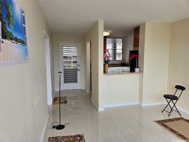1535 Pensacola St Unit 36, Honolulu, HI 96822 - corridor featuring light tile patterned floors and baseboards