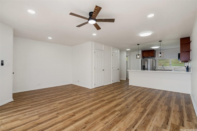 92-801 Makakilo Dr Unit H50, Kapolei, HI 96707 - unfurnished living room with recessed lighting, ceiling fan, and light wood finished floors