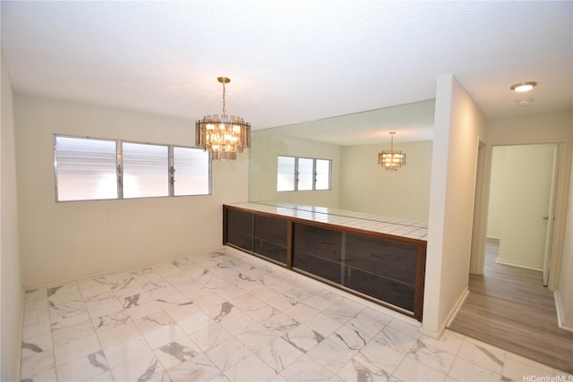 3152 Mokihana Sts, Honolulu, HI 96816 - unfurnished room with a chandelier, baseboards, and a smoke detector