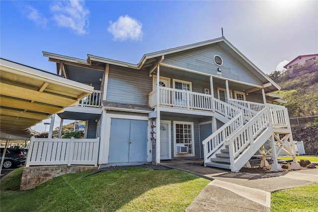 92-918 Hame Pl Unit 21/103, Kapolei, HI 96707 - view of front of house with stairs, a front yard, cooling unit, a balcony, and a porch
