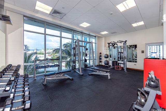 1189 Waimanu St Unit 2308, Honolulu, HI 96814 - gym featuring expansive windows, baseboards, visible vents, and a wealth of natural light