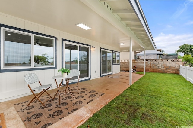 view of patio / terrace featuring fence
