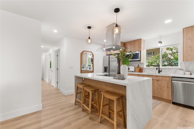 kitchen featuring a kitchen island, modern cabinets, light wood-type flooring, dishwasher, and a sink