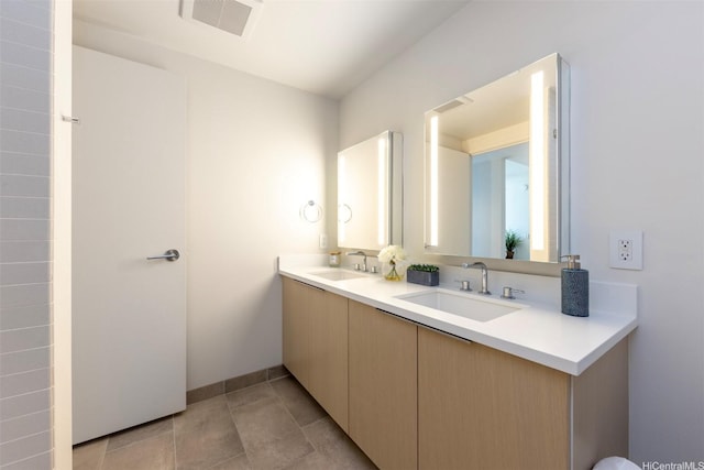 1001 Queen St Unit 1804, Honolulu, HI 96814 - bathroom with double vanity, baseboards, and tile patterned flooring