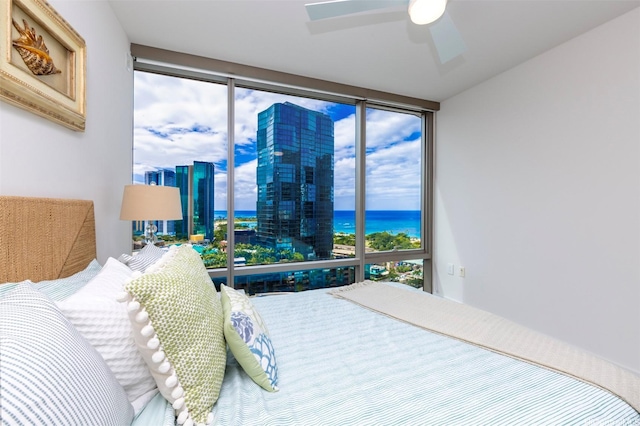 1001 Queen St Unit 1804, Honolulu, HI 96814 - bedroom with a water view, multiple windows, a wall of windows, and a ceiling fan