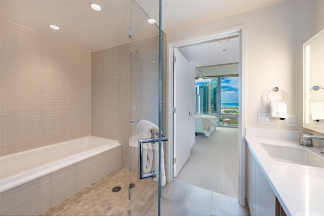 1001 Queen St Unit 1804, Honolulu, HI 96814 - ensuite bathroom with a tile shower, tile patterned floors, vanity, recessed lighting, and a bath