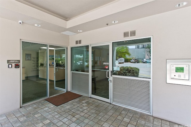 1133 Waimanu St Unit 201, Honolulu, HI 96814 - property entrance featuring visible vents and stucco siding