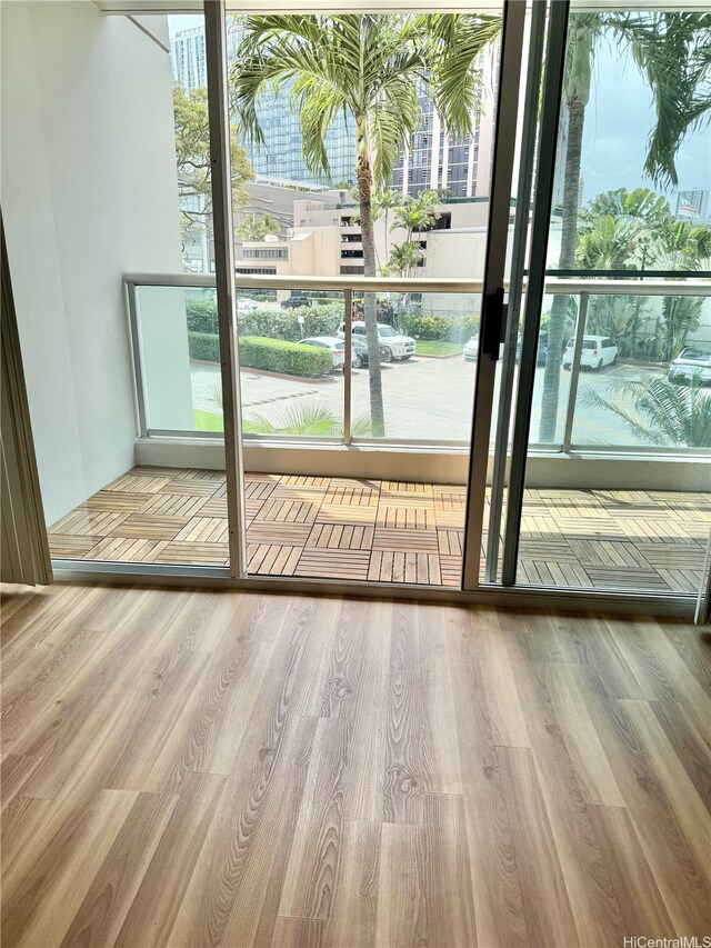 1133 Waimanu St Unit 201, Honolulu, HI 96814 - doorway to outside with wood finished floors