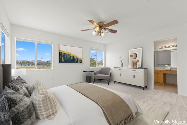 91-1459 Pukanala St, Ewa Beach, HI 96706 - bedroom featuring ceiling fan, ensuite bath, and light carpet