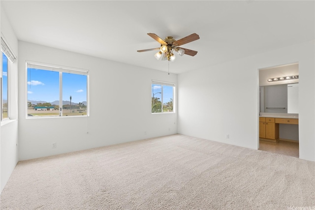 91-1459 Pukanala St, Ewa Beach, HI 96706 - unfurnished bedroom featuring a ceiling fan, light carpet, and ensuite bath