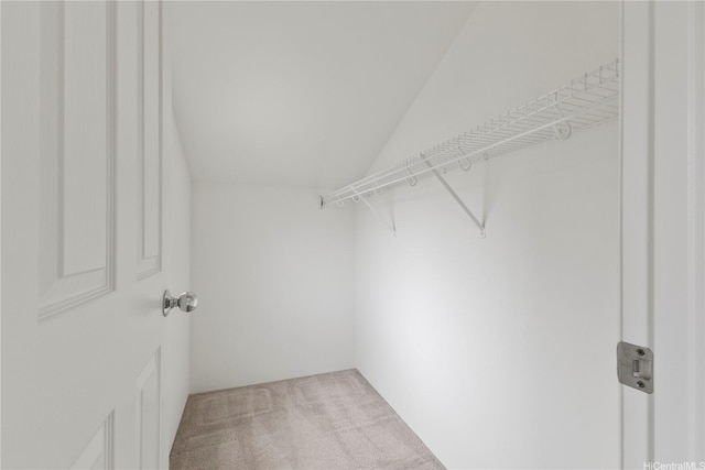 91-1459 Pukanala St, Ewa Beach, HI 96706 - walk in closet featuring vaulted ceiling and carpet flooring
