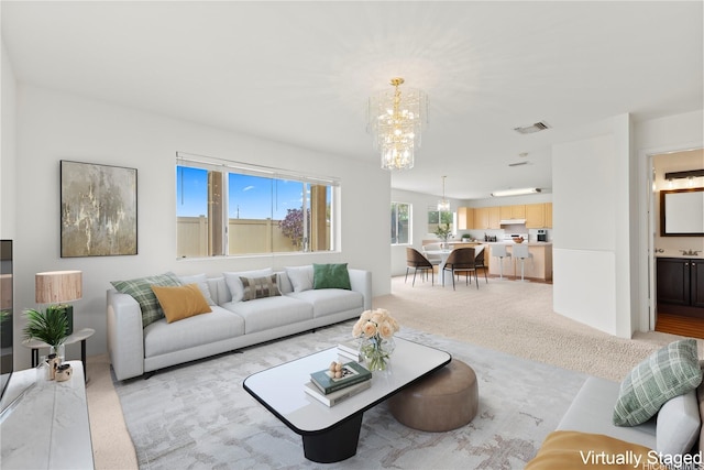 91-1459 Pukanala St, Ewa Beach, HI 96706 - living room with a chandelier, light carpet, and visible vents
