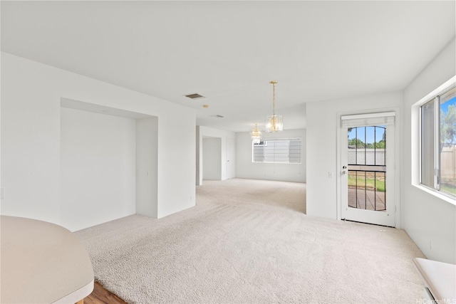 91-1459 Pukanala St, Ewa Beach, HI 96706 - carpeted empty room with an inviting chandelier and visible vents