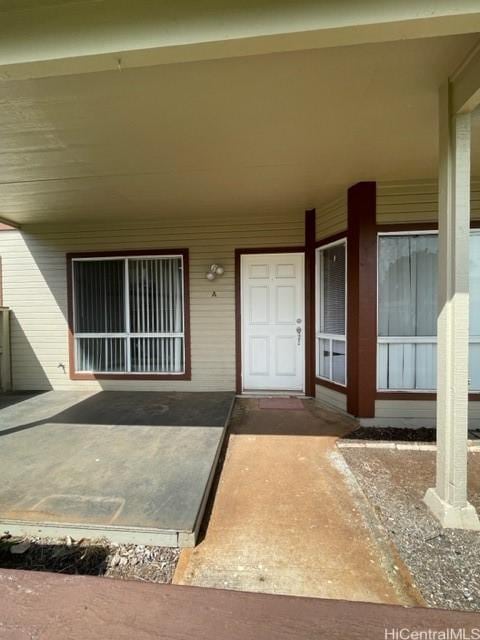 property entrance with covered porch
