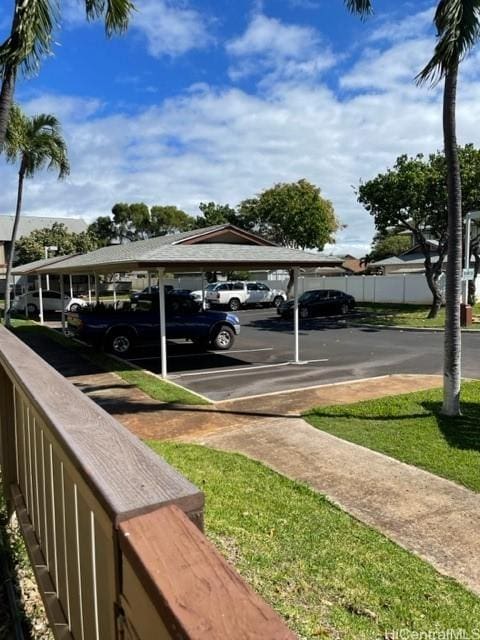 view of partially covered parking lot