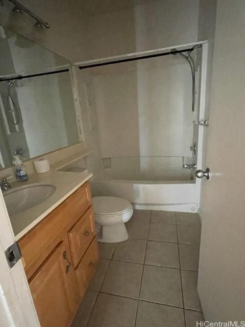 bathroom featuring vanity, tile patterned floors, bathtub / shower combination, and toilet