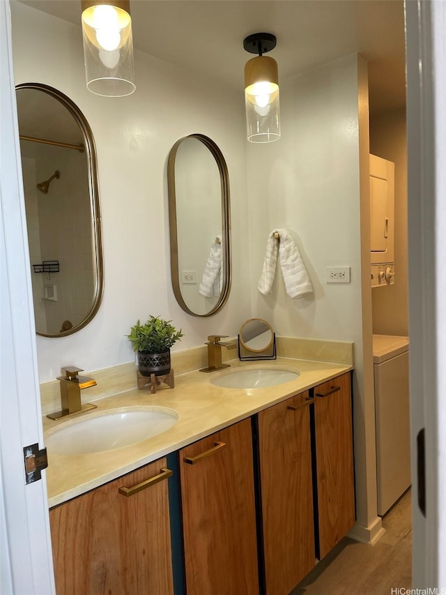 full bathroom featuring double vanity and wood finished floors