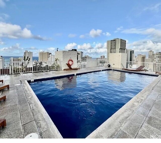 444 Nahua St Unit 1104, Honolulu, HI 96815 - community pool featuring a city view, fence, and a patio area