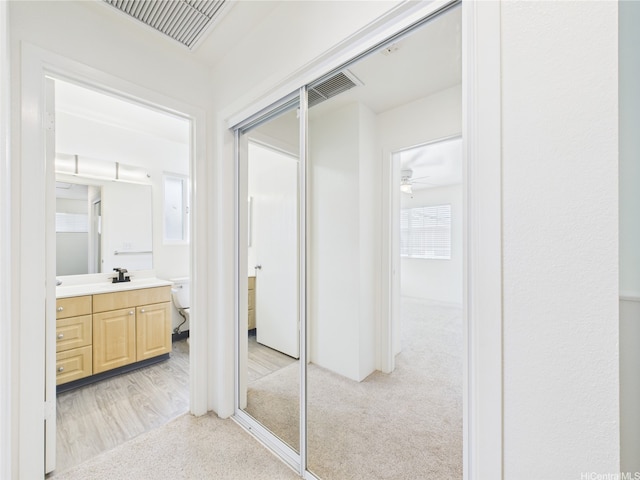 bathroom with vanity, ceiling fan, and toilet