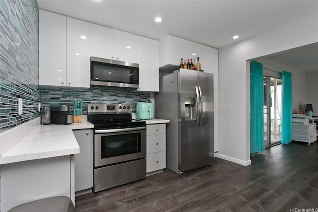 91-104 Auhola Pl, Ewa Beach, HI 96706 - kitchen featuring light countertops, backsplash, stainless steel appliances, and dark wood finished floors
