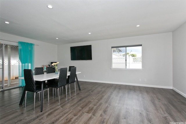 dining space with recessed lighting, baseboards, and dark wood-style floors