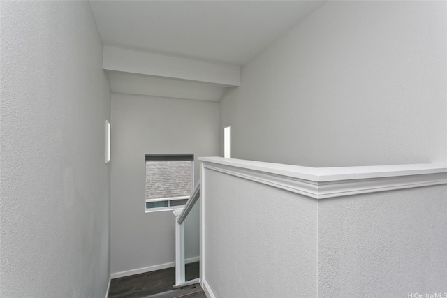 stairway with baseboards and wood finished floors