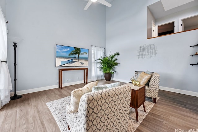 92-1288 Kikaha St Unit 78, Kapolei, HI 96707 - living area with baseboards, a high ceiling, a ceiling fan, and wood finished floors