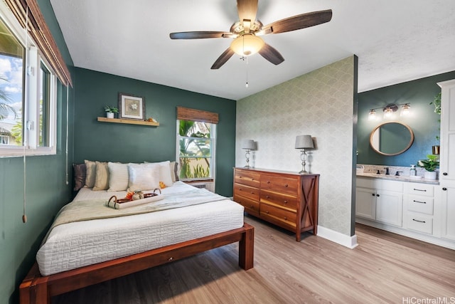 92-1288 Kikaha St Unit 78, Kapolei, HI 96707 - bedroom featuring baseboards, a ceiling fan, light wood-style floors, and ensuite bath