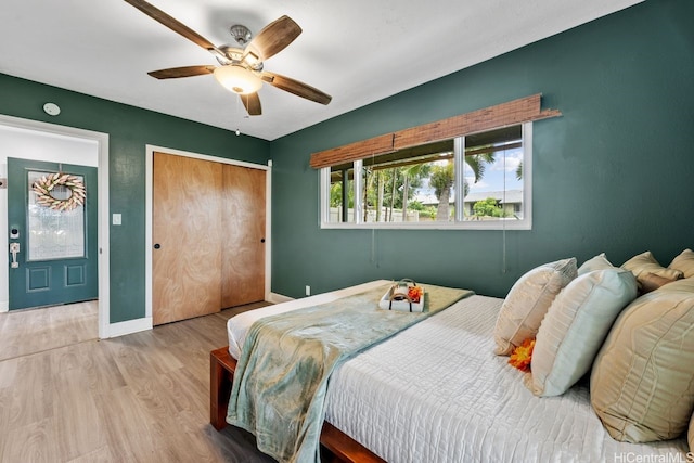 92-1288 Kikaha St Unit 78, Kapolei, HI 96707 - bedroom featuring baseboards, a ceiling fan, wood finished floors, and a closet