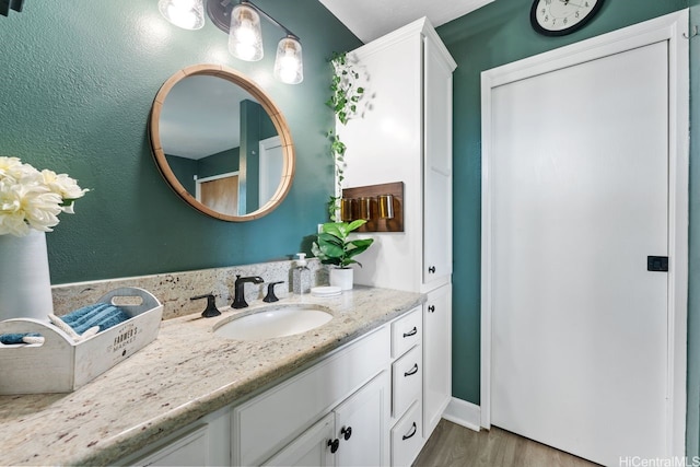 92-1288 Kikaha St Unit 78, Kapolei, HI 96707 - bathroom with vanity and wood finished floors
