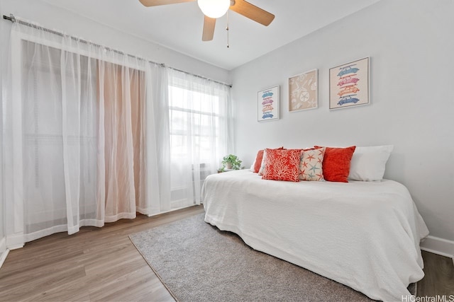 92-1288 Kikaha St Unit 78, Kapolei, HI 96707 - bedroom featuring baseboards, ceiling fan, and wood finished floors