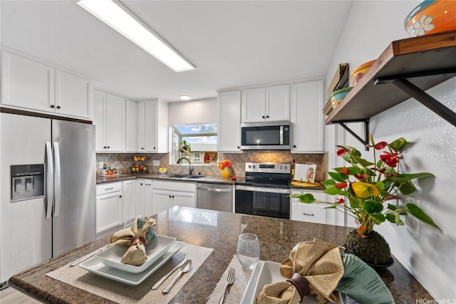 92-1288 Kikaha St Unit 78, Kapolei, HI 96707 - kitchen featuring a sink, decorative backsplash, stainless steel appliances, and white cabinetry