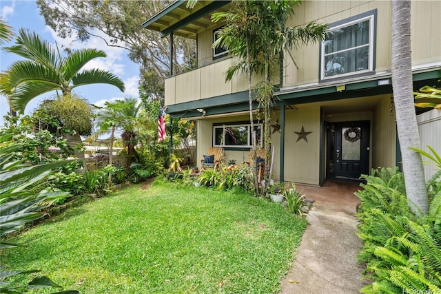 92-1288 Kikaha St Unit 78, Kapolei, HI 96707 - doorway to property with fence, a yard, and a balcony