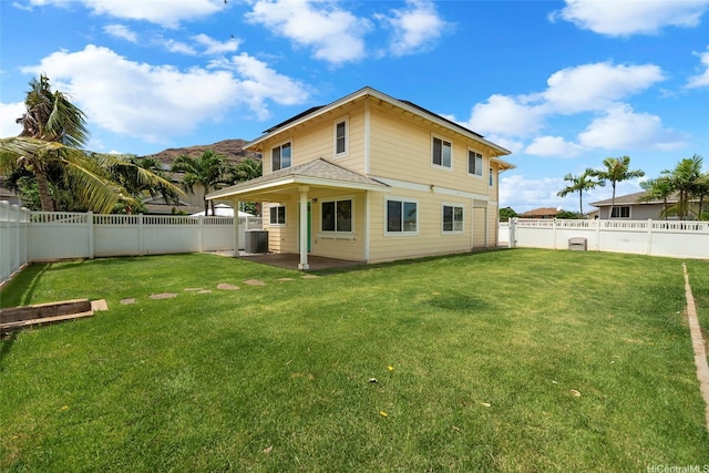 87-1847 Polikua St, Waianae, HI 96792 - rear view of house featuring a fenced backyard and a patio area