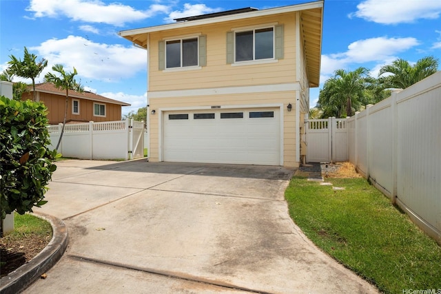 87-1847 Polikua St, Waianae, HI 96792 - view of front of property with a gate, an attached garage, and driveway