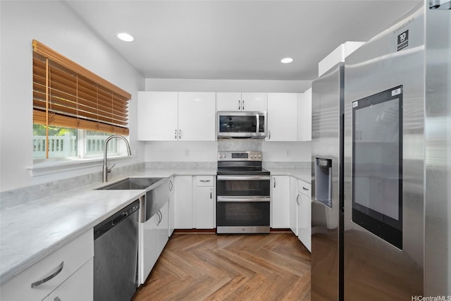 87-1847 Polikua St, Waianae, HI 96792 - kitchen with appliances with stainless steel finishes, light countertops, white cabinets, and recessed lighting